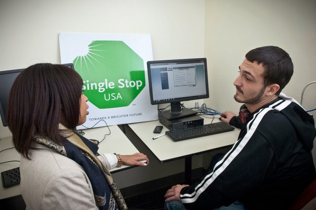 Chantal Whitehead, assistant project director at the Single Stop office at Community College of Philadelphia, talks with student Edward Busch about the service.